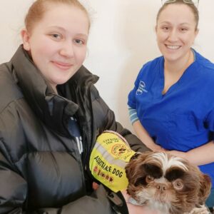Olga Jones of Pure Movement Clinic, Lydney with a patient and their assistance dog