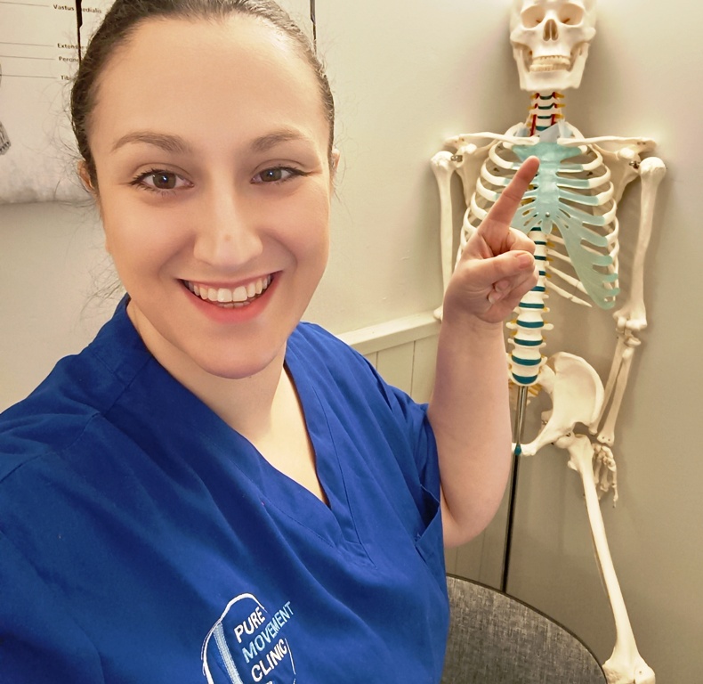 Olga Jones of Pure Movement Clinic, Gloucester with a skeleton